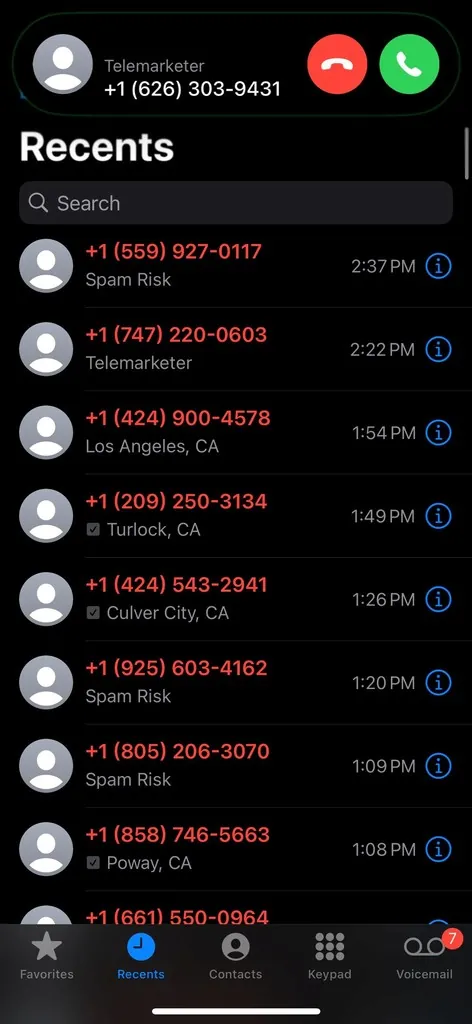 A phone's recent calls list showing spam risk and telemarketer calls